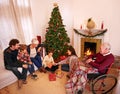 Big family, Christmas and giving present or gift with children, parents and grandparents together for love, care and Royalty Free Stock Photo