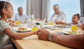 Big family, dinner prayer and worship with holding hands before eating food at home. Children, grandparents and Royalty Free Stock Photo