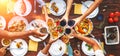 Big family dinner. Vertical top view on served table and hands w Royalty Free Stock Photo