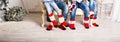 Big family of father, mother, sister, brother and baby in Christmas socks Royalty Free Stock Photo