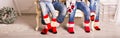 Big family of father, mother, sister, brother and baby in Christmas socks Royalty Free Stock Photo