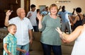 Big family dancing in living room