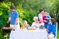 Big family grilling meat for lunch Royalty Free Stock Photo