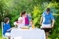 Big family grilling meat for lunch Royalty Free Stock Photo