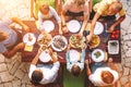 Big family have a dinner with fresh cooked meal on open garden terrace Royalty Free Stock Photo