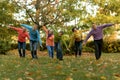 Big family having fun together in autumnal park Royalty Free Stock Photo