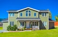 Big family house with pathway to the door in front and blue sky background Royalty Free Stock Photo