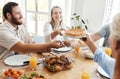 Big family, lunch and food in home dining room with people sharing a meal. Love, happy and relatives eating food, bread Royalty Free Stock Photo