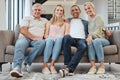 Big family, portrait and relax on sofa in home living room, smiling and bonding. Love, care and interracial couple Royalty Free Stock Photo