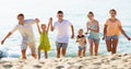 Big family running on beach Royalty Free Stock Photo