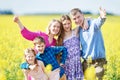 Big family in summer field outdoors. Royalty Free Stock Photo