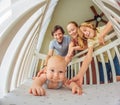 Big family with two kids in white bedroom. Parents and kids standing at crib of newborn baby boy. Boy meeting new Royalty Free Stock Photo