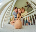 Big family with two kids in white bedroom. Parents and kids standing at crib of newborn baby boy. Boy meeting new Royalty Free Stock Photo