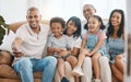 Big family, watching tv and laughing in home living room on sofa, bonding and having fun. Television, parents and Royalty Free Stock Photo