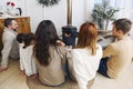 Big family wearing warm woolen socks resting by fireplace together Royalty Free Stock Photo