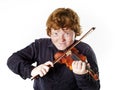 Big fat red-haired boy with small violin Royalty Free Stock Photo