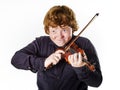Big fat red-haired boy with small violin Royalty Free Stock Photo