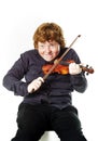 Big fat red-haired boy with small violin Royalty Free Stock Photo