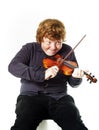 Big fat red-haired boy with small violin Royalty Free Stock Photo