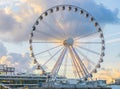 Big ferris wheel attraction at the pier of Scheveningen beach Holland a well-known and touristic town Royalty Free Stock Photo