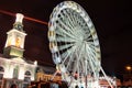 Evening view of the Andreevsky Descent. Big ferris wheel at Christmas market`s at the Kontraktova Square