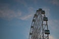 Big Ferris wheel in front of blue sky