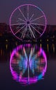 Big ferris wheel at night. Colorful reflection on the lake. Royalty Free Stock Photo