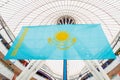 Big flag of Kazakhstan, national flag of Republic of Qazaqstan in Khan Shatyr Entertainment Center