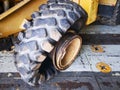 big flat tyre of old used buldozer Royalty Free Stock Photo