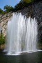 Big fontain by rock, walking in smallest medieval town in world Durbuy on river Ourthe, Ardennen, Belgium Royalty Free Stock Photo