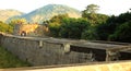 People on the big fort battlement and large wall at vellore fort with sunset