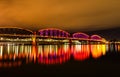 Big Four Bridge reflecting on a river, illuminated at night in Louisville, Kentucky Royalty Free Stock Photo