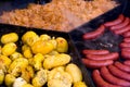 Catering food, sausages with potatoes and stewed cabbage Royalty Free Stock Photo