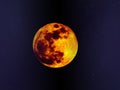 Big full colourful yellow red moon in dark navy blue sky and some small stars.