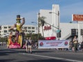 Big fun man riding bicycle, Showmanship Award float in the famous Rose Parade Royalty Free Stock Photo