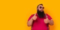 Big funny bearded man wearing sunglasses and doing thumbs up