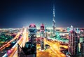 Big futuristic city with world tallest skyscrapers. Aerial nighttime skyline of Dubai, UAE.