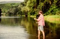big game fishing. relax on nature. mature bearded man with fish on rod. successful fisherman in lake water. hipster Royalty Free Stock Photo