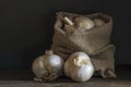 big Garlic Cloves and Bulb wooden table cooking on dark background. burlap sack cutting board copy space Close-up rustic still Royalty Free Stock Photo