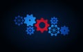 The big gear is red, and around it are smaller blue gears on a dark background . Royalty Free Stock Photo