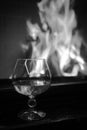 Big glass of cognac and fire Royalty Free Stock Photo