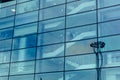 Big glass wall of modern futuristic office business building, reflection Royalty Free Stock Photo