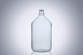 Big glass water bottle demijohn isolated on white background