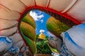 Big gold buddha and naga status in tham pha daen temple, the famous place of Sakon Nakhon Province, Thailand Royalty Free Stock Photo