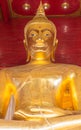 Big gold buddha statue . close up . Wat Mong khon Bophit temple . symbol of landmark Ayutthaya Thailand place .