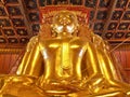 Big golden Buddha image in ancient Buddhist temple - Wat Phumin, Nan province, Thailand. Royalty Free Stock Photo