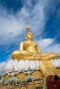 Big Golden Buddha statue against blue sky in Tiger Cave temple Royalty Free Stock Photo