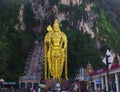 Big golden Buddha statue in front of the religious site of Batu Caves in Malaysia Royalty Free Stock Photo