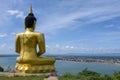 The Big Golden Buddha Statue Of Phu Salao Temple With Mekong River Flows Through The Pakse City,Laos