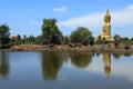 Big golden buddha statue sitting reflection on the water Royalty Free Stock Photo